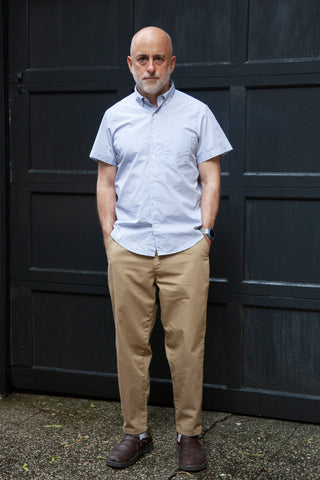 Model wearing short sleeve single needle shirt tattersall, khaki lightweight danver pants and brown shoes.