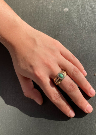 Vintage turquoise and diamond ring on model hand front