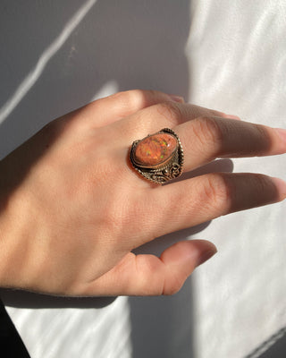 Vintage Pink fire ring on model hand close up